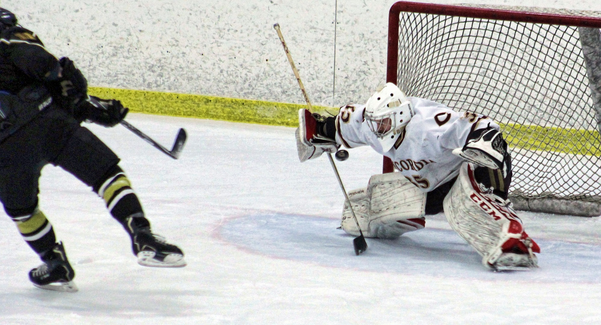 Freshman goalie Sam Nelson makes a save in the shootout in the Cobbers' game with St. Olaf. He stopped two of the three shootout attempts and several other breakaways in regulation.