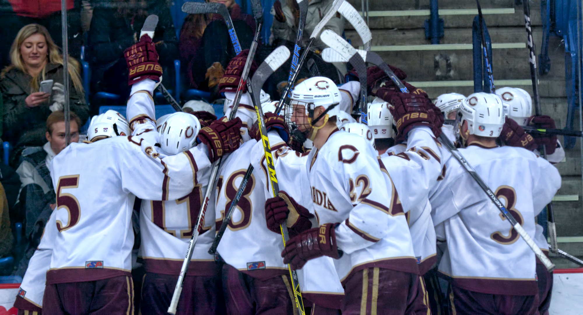 Concordia players spill on to the ice to celebrate Dalton Mills' game-winning goal in overtime against St. Mary's.