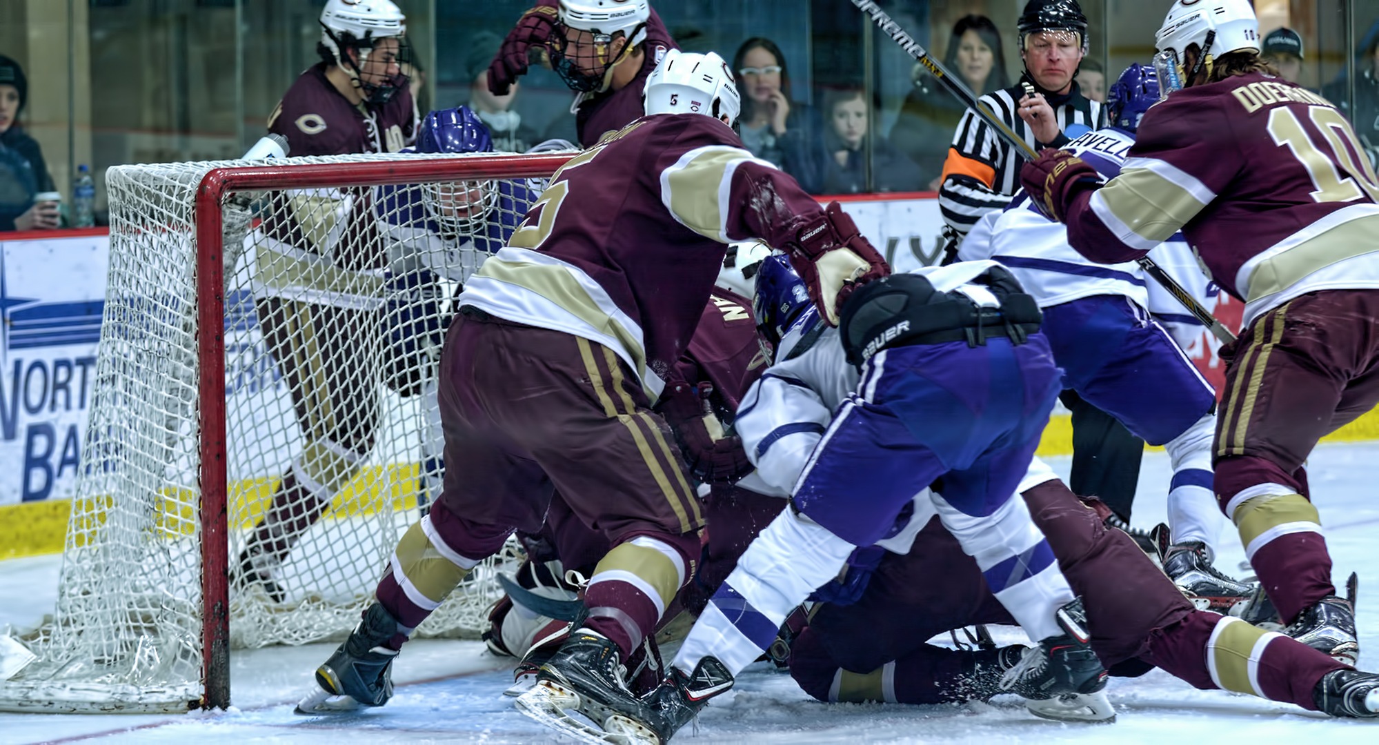 Players collide at the Concordia goal during the series finale on Saturday.