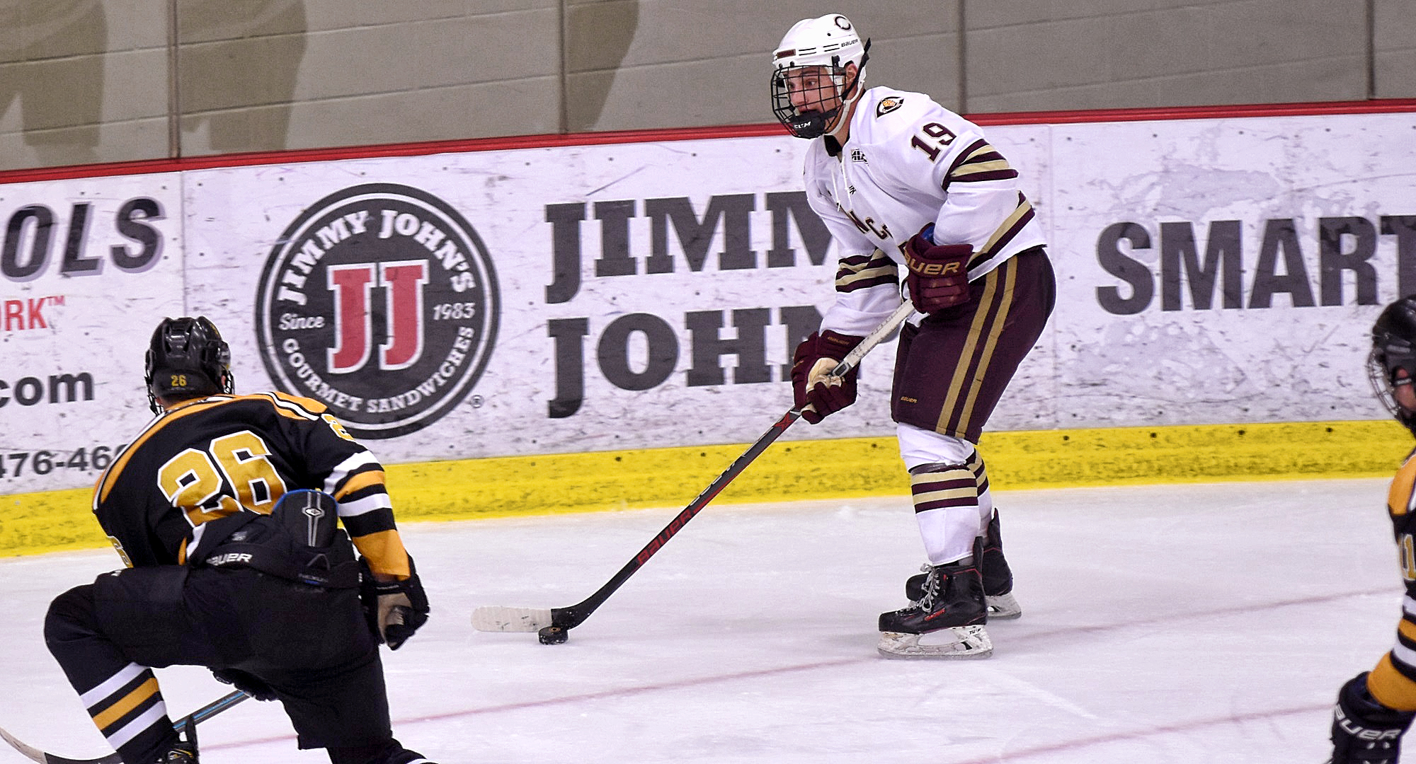 Sophomore Tyler Bossert looks to move the puck on the power play in the second period of the Cobbers' 5-1 win over St. Olaf.