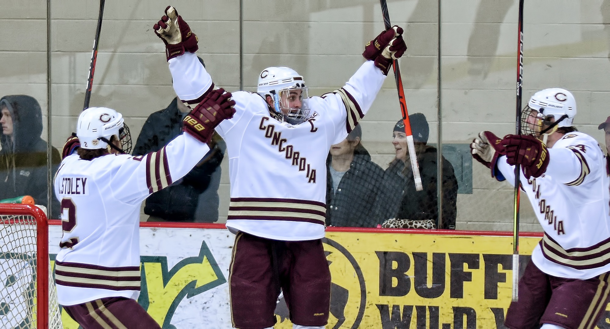 Senior captain Joe Burgmeier raises his arms in celebration after scoring the game-winning goal against No.3-ranked Wis.-Eau Claire.