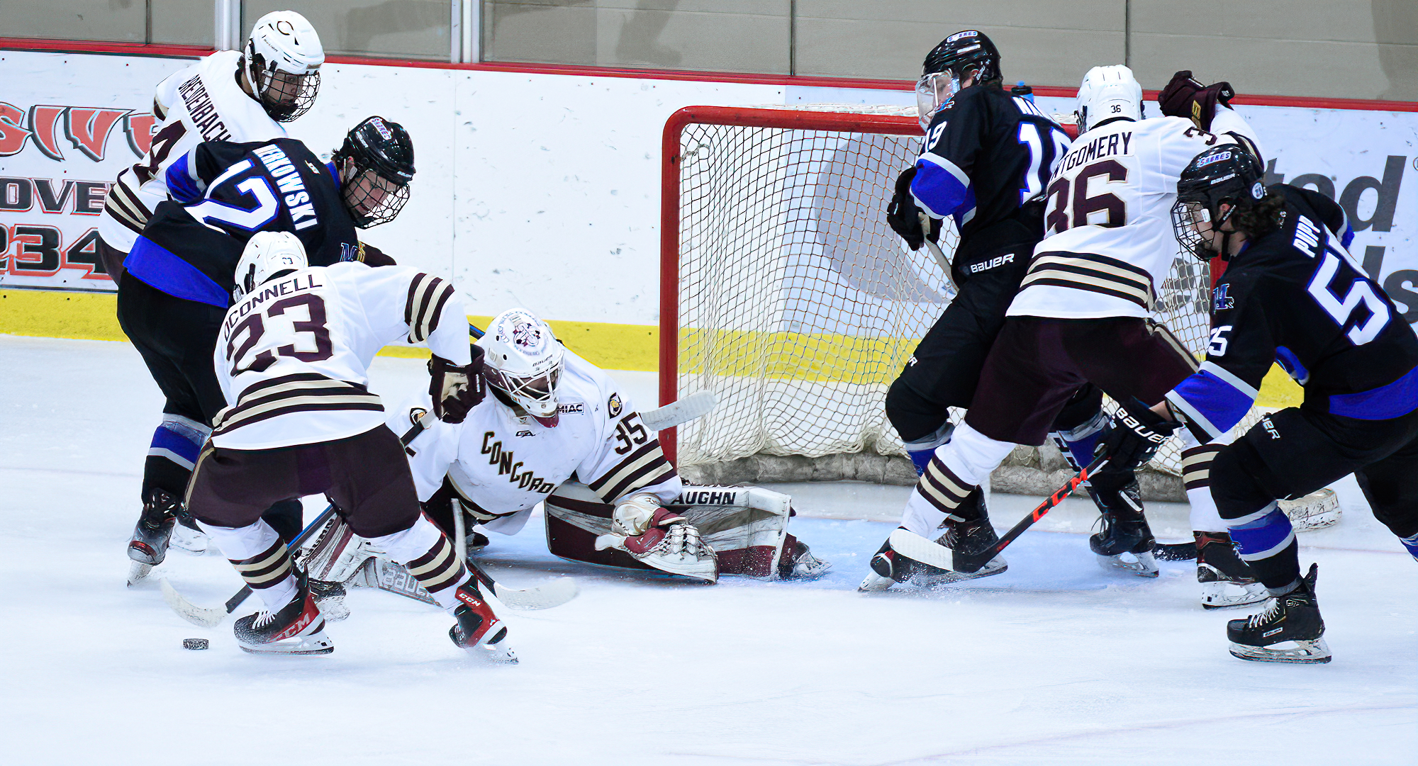 Jackson Nelson goes down to block the puck during the second period of the Cobbers' win over Marian. Nelson had 29 saves in the win.