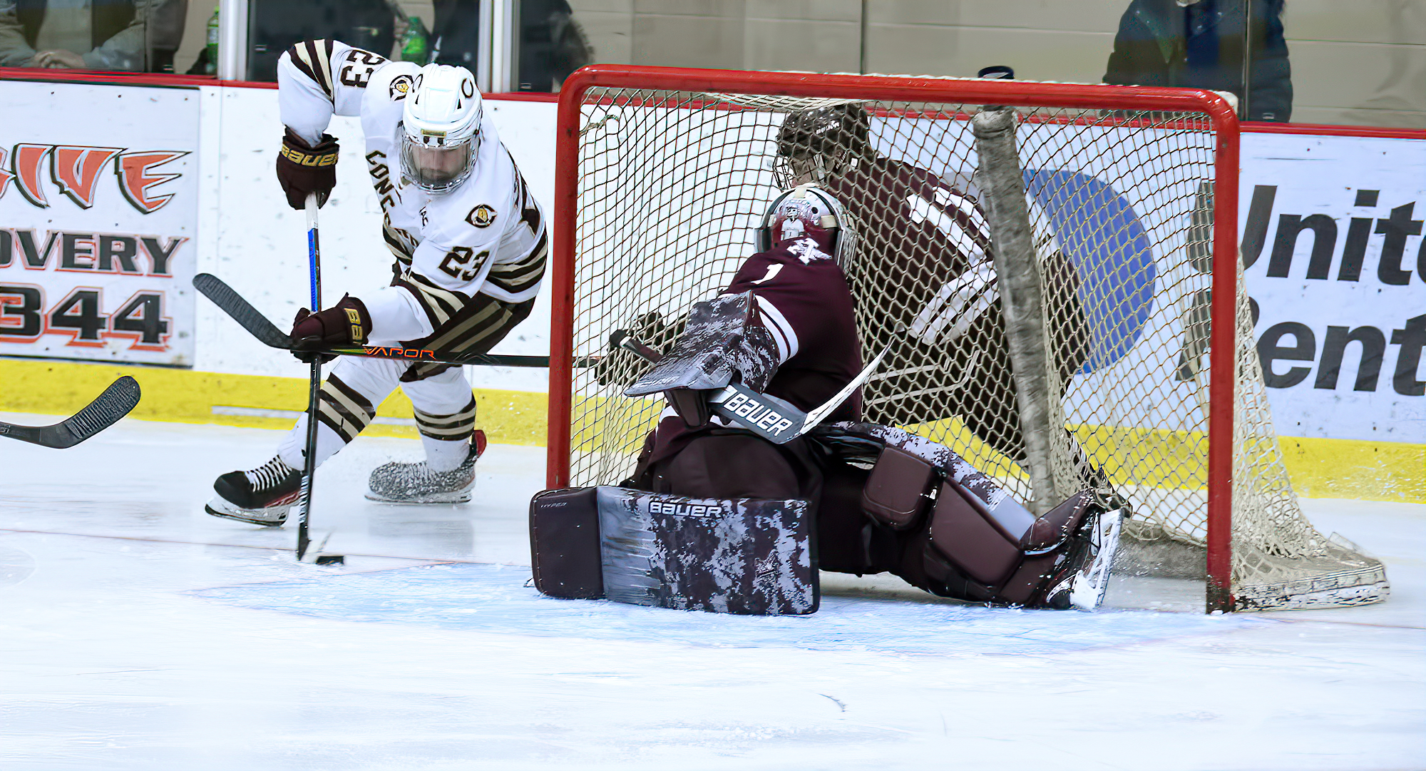 Cole O'Connell goes for the wraparound in the second period of the Cobbers 4-2 win against Augsburg. O'Connell scored the team's second goal.