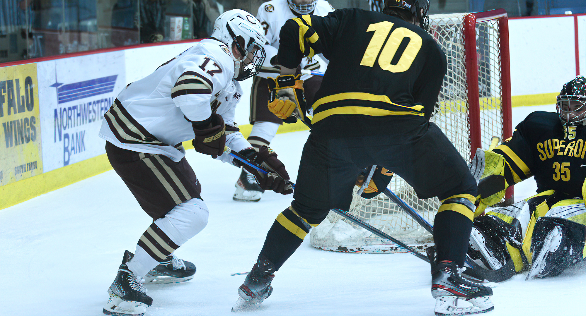 Freshman Mason Plante tries to jam the puck into the net in the Cobbers' game with UW-Superior. He had two goals and an assist in the 2022 opener.