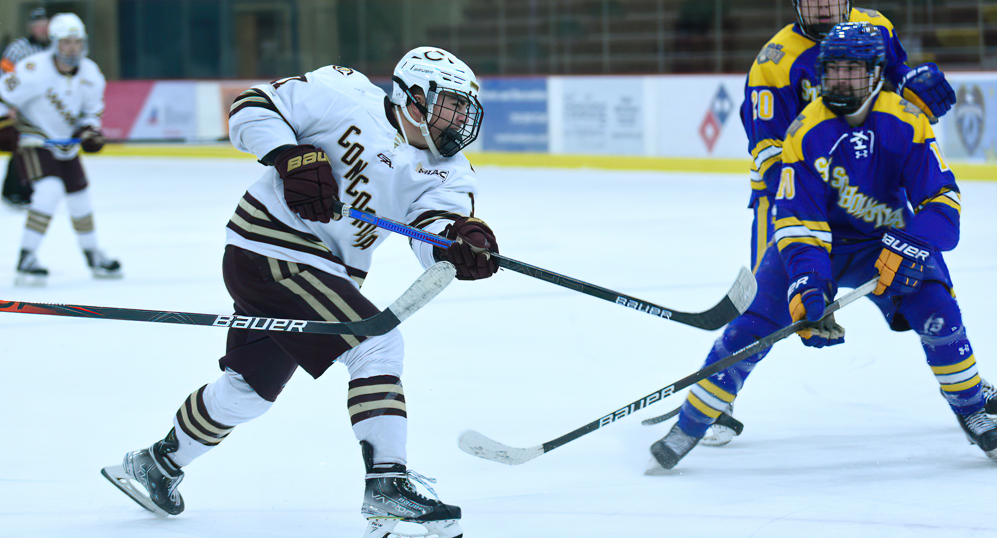 Mason Plante fires a puck on goal during the third period of the Cobbers' 4-1 win over St. Scholastica. Plante had two goals and an assist in the game.