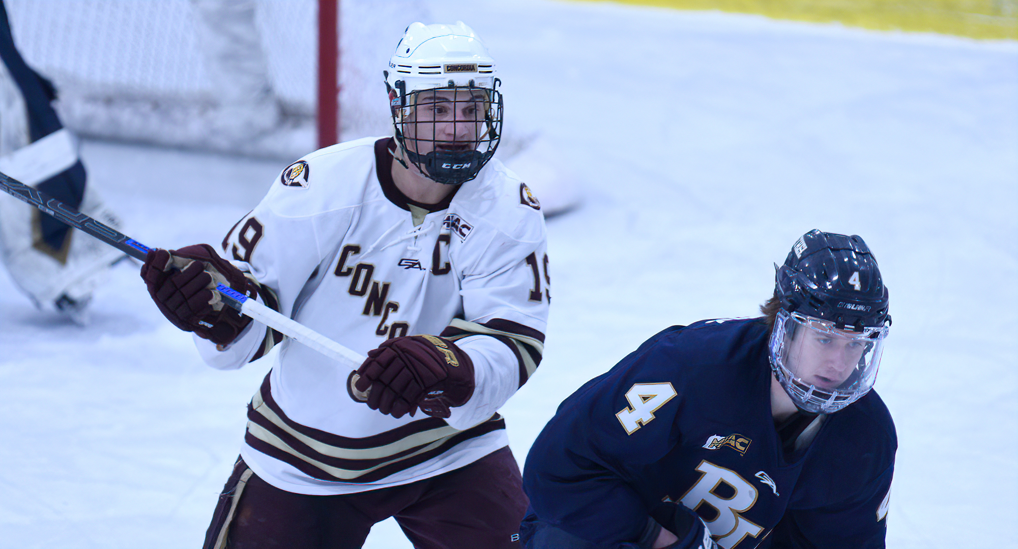 Tyler Bossert sets up camp by the Bethel goal during the Cobbers' game with Bethel. He had three points and now has 30 for the season.