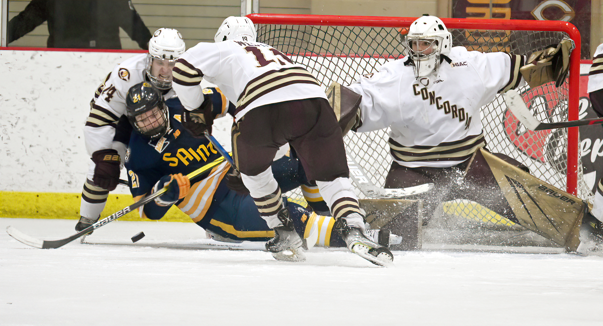 The Cobber defense clears out a St. Scholastica forward after goalie Matt Fitzgerald made a huge save in the final minute of play in CC's 2-1 win.