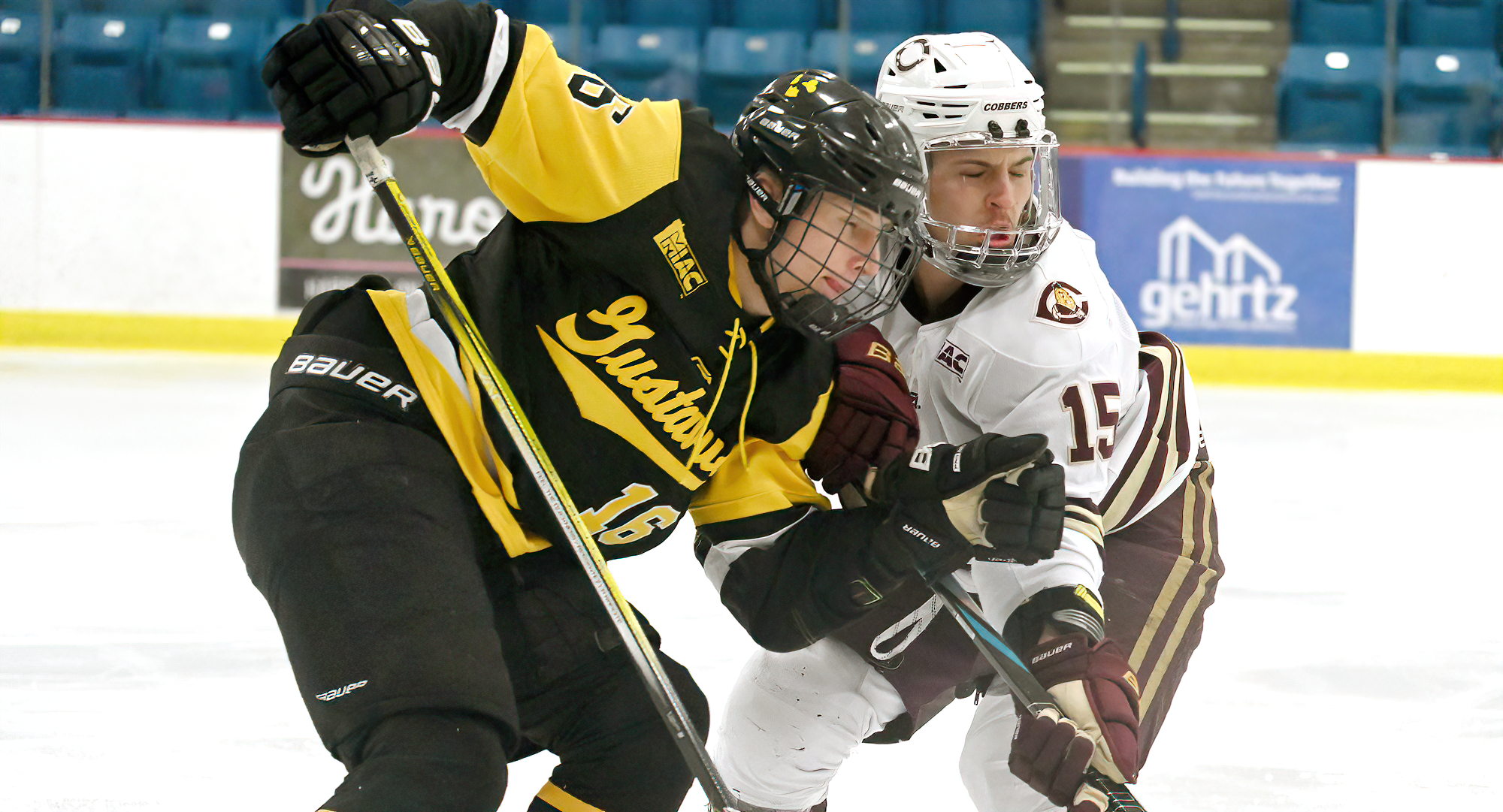 Blaise Miller battles a Gustavus player for the puck in the series opener. Miller led the team in shots.