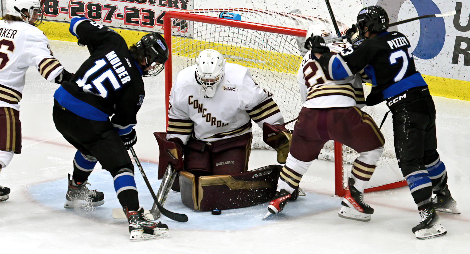 Sophomore goalie Brock Moroz makes one of his 25 saves in the Cobbers' overtime game with Marian (Wis.).