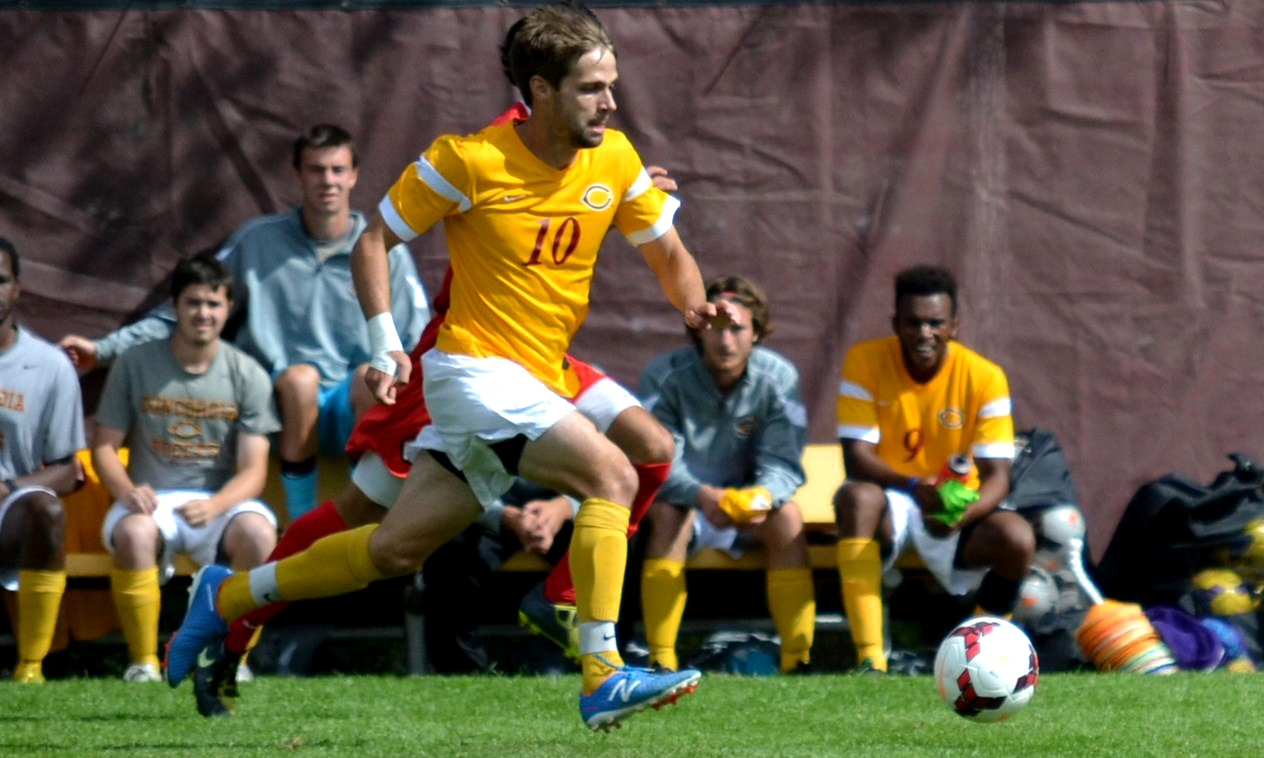 Sage Thornbrugh scored one of the two Cobber goals vs. St. Scholastica. (Photo by Howard Fulks)