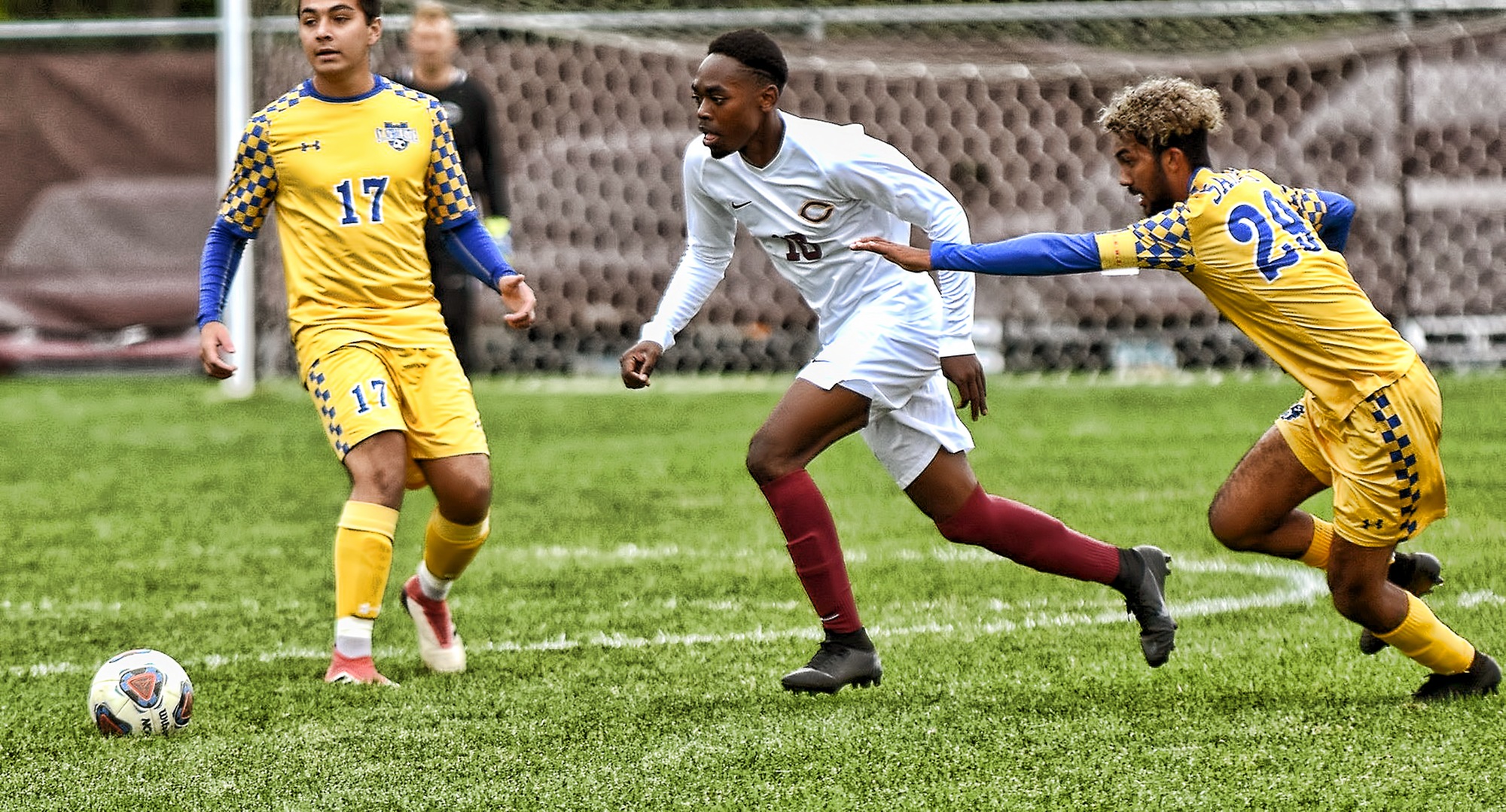 Nigaba Olivier dribbles throught the St. Scholastica defense in the Cobbers' win. He scored his first collegiate goal in the team's 4-goal second half.