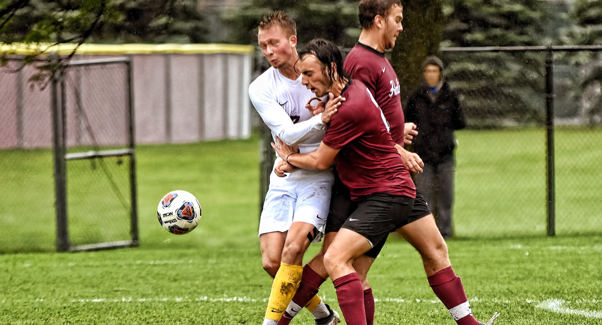 Senior Sam Gess collides with a Hamline player during the Cobbers' 4-2 win. Gess scored three goals in the second half.