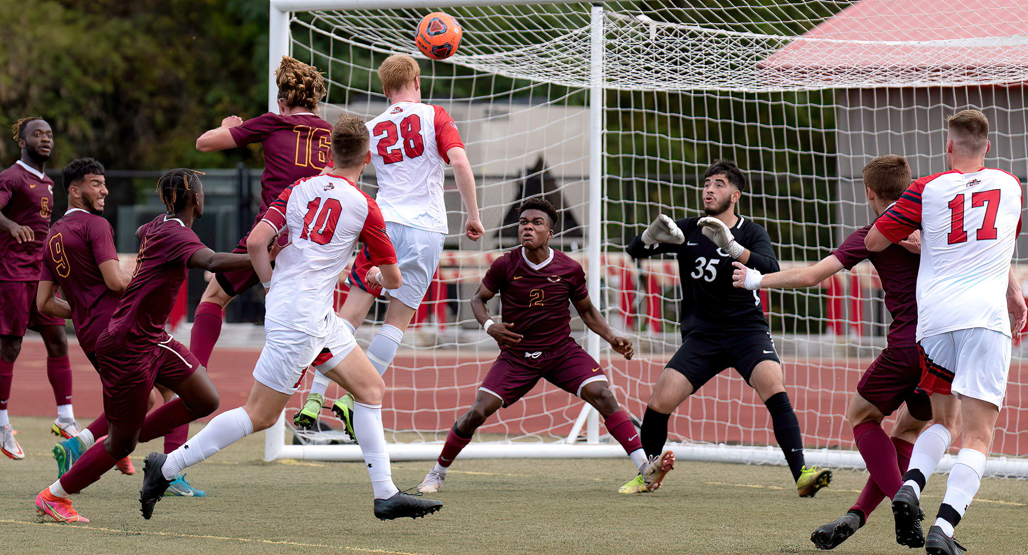 The Cobber defense converges on a would-be goal scorer in their 2-0 win at St. Mary's. Goalie Erick Torres (#35) made six saves to get the shutout. (Photo courtesy of SMU Sports Information)