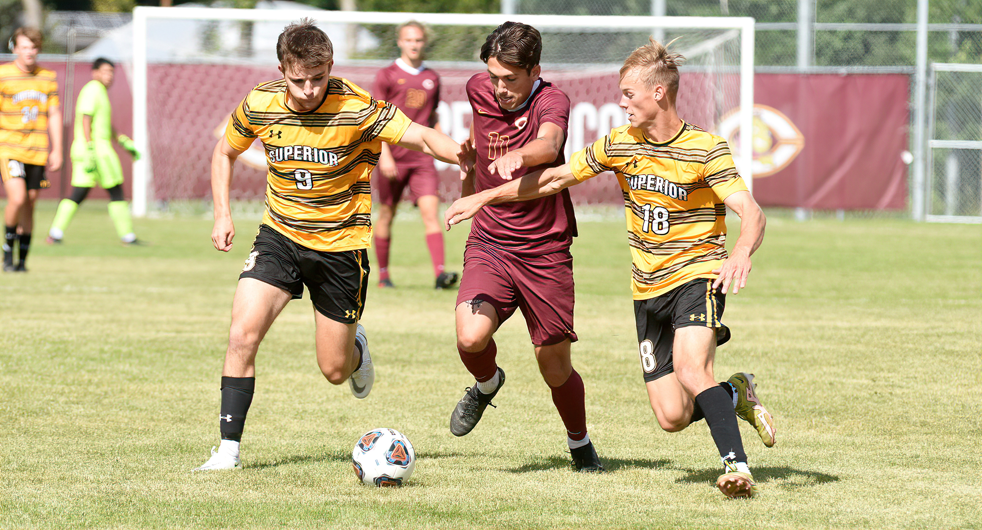 Senior Nate Weaver breaks through the UW-Superior defense in the second half of the Cobbers' game with the Yellowjackets.
