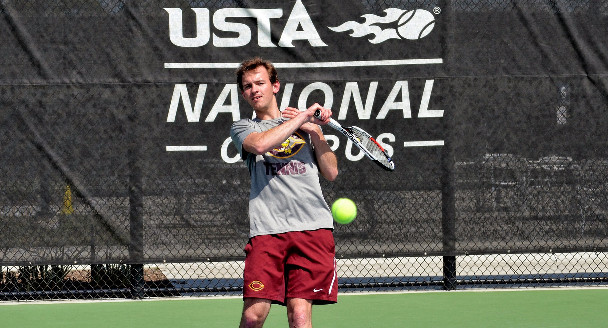 Senior David Youngs hits a forehand during his match at the USTA National Tennis Center. Youngs won his team-leading eighth singles match on Thursday.  (Photo courtesy of Jeff Meyer)