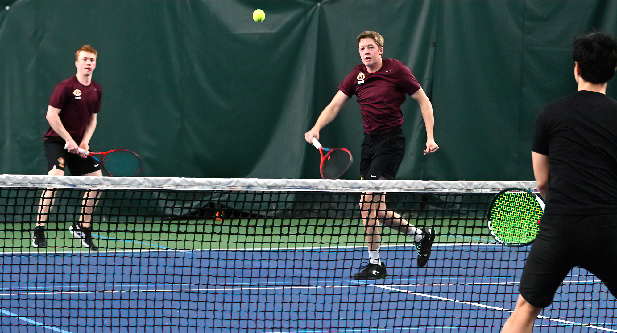 Freshman Daniel Skrade goes cross-court for a winner in his No.3 doubles win with Hunter Rice. Skrade also won his match at No.6 singles.