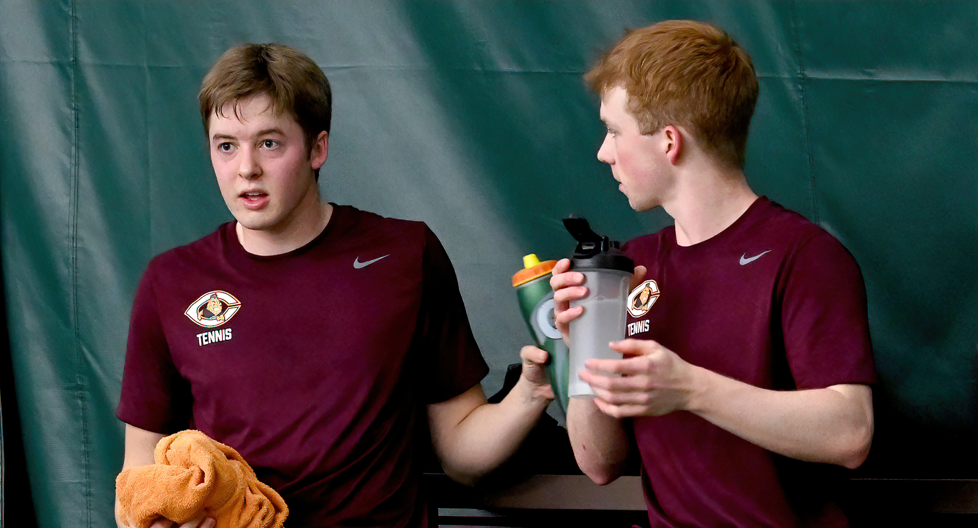 Daniel Skrade (L) and Hunter Rice talk over strategy between games. The duo claimed a team point with an 8-3 win at No.3 doubles.