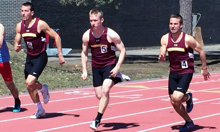 Chris Cunningham (L), Ben Vickstrom (M) and Dominic Neameyer race down the track in the 100 meters at the SJU Invite.