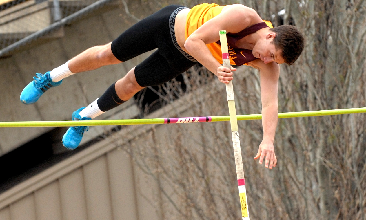 Sophomore Eli Beachy clears the bar in the pole vault on his way to winning the event at the annual Cobber Twilight Meet.
