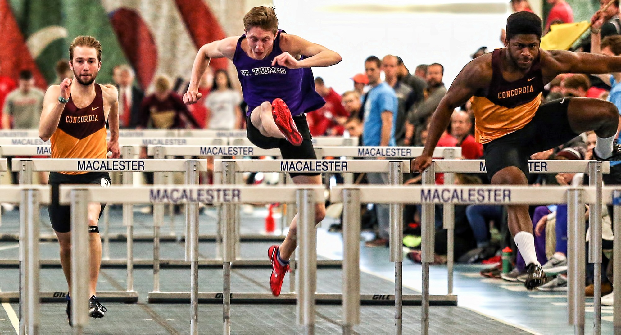 Willie Julkes (R) races through the 60-meter hurdles on his way to finishing in fifth place in the event. (Photo courtesy of Nathan Lodermeier)