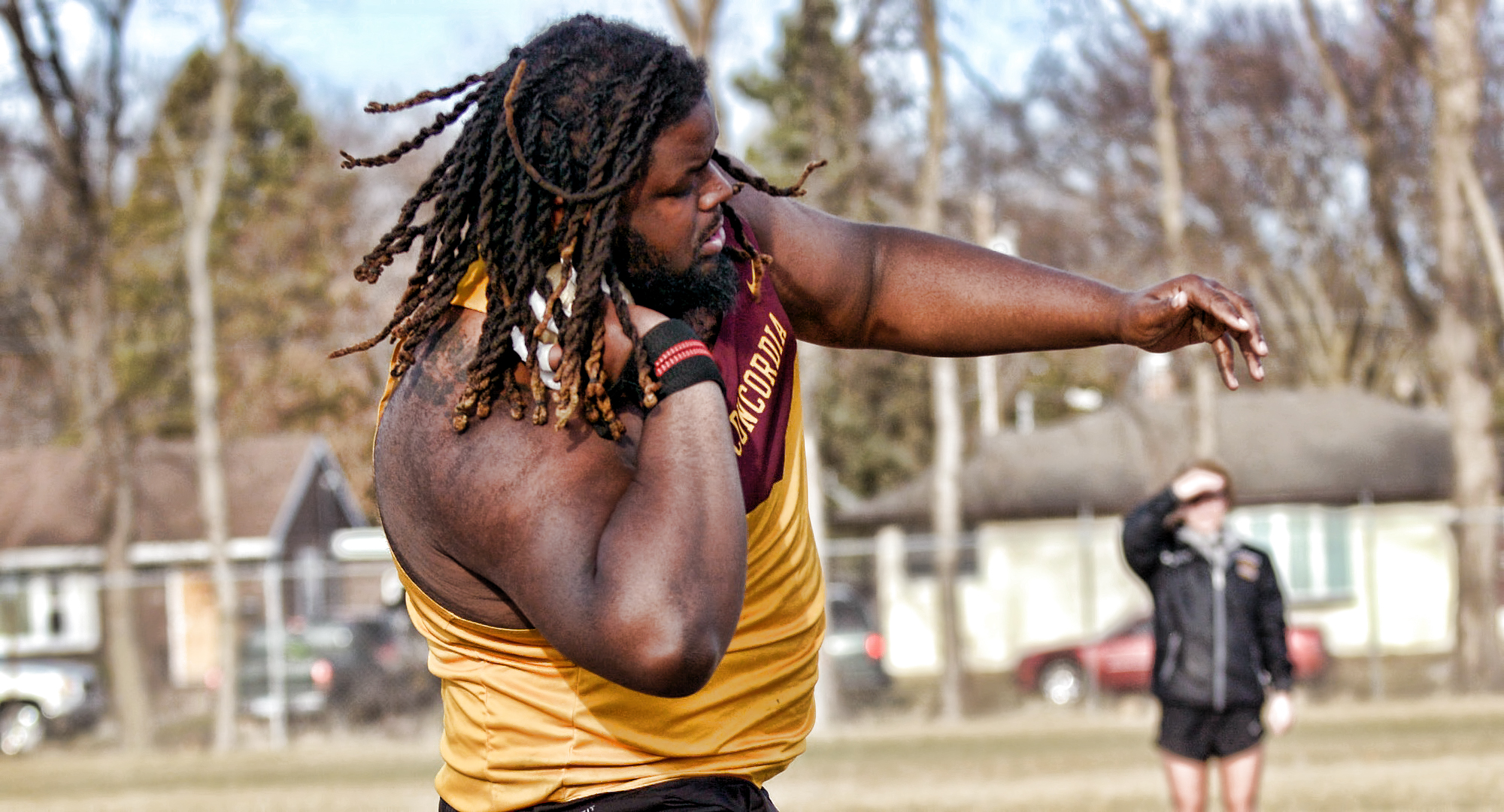 Senior Adam Frazier gets ready to unleash the winning throw in the shot put at the Cobber Twilight Meet.