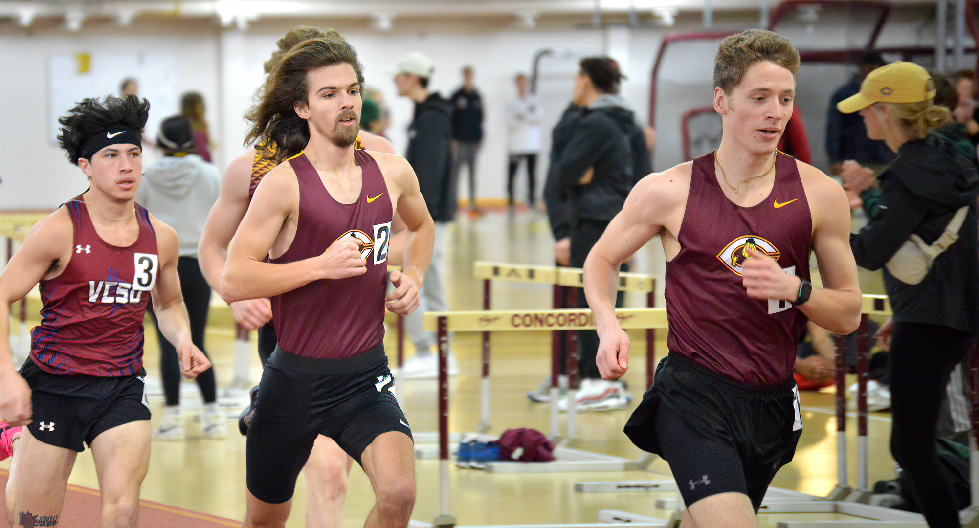 Joe Lee (R) and Tanner Olson (M) take to the lead in the mile during the season-starting Cobber Open. The duo finished 1-2 in the race.