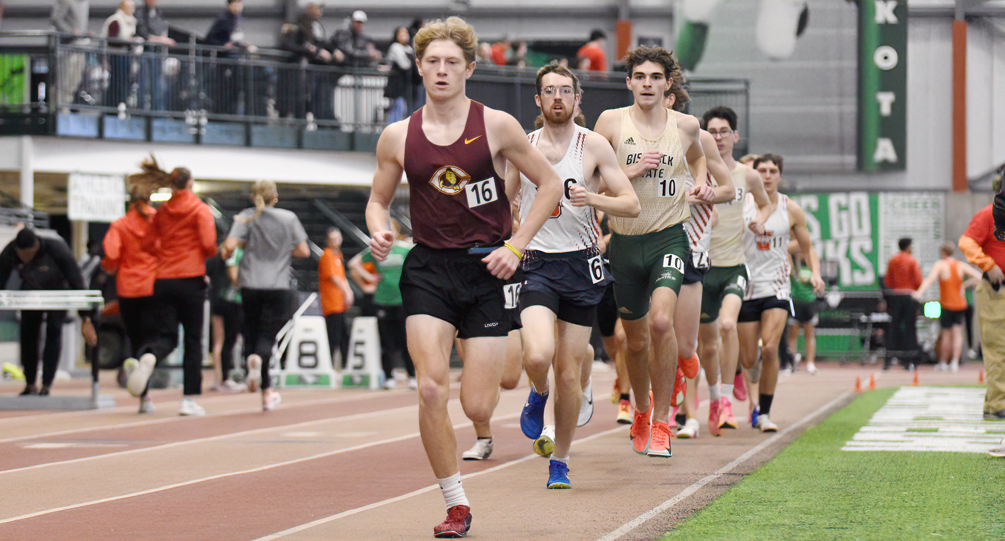 Tyler Goss leads a pack of runners in the 5000 meters at the UND Open. He ran a time of 15:46 which is his fastest indoor 5K.