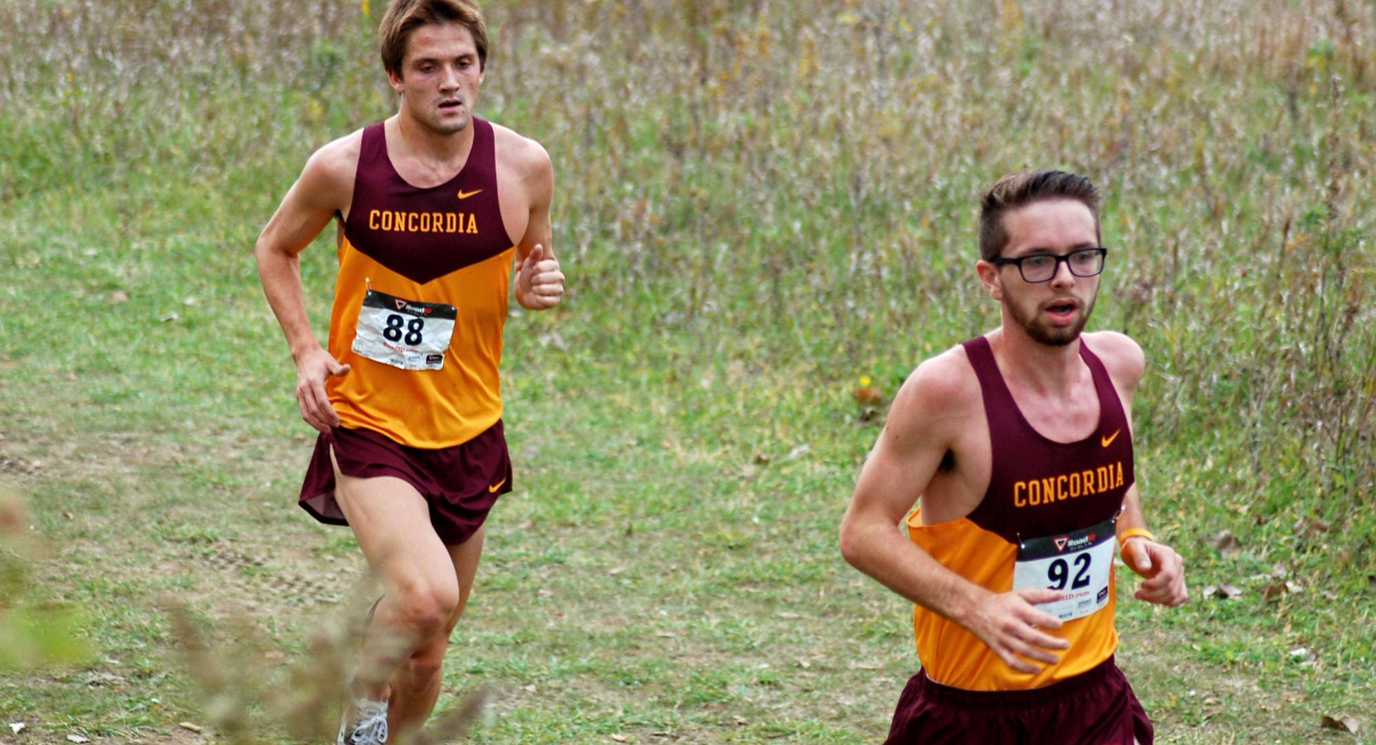 Freshman Eric Wicklund leads teammate Brandon Quibell through the course at Crown. Wicklund placed fifth and helped CC to a second-place team finish.