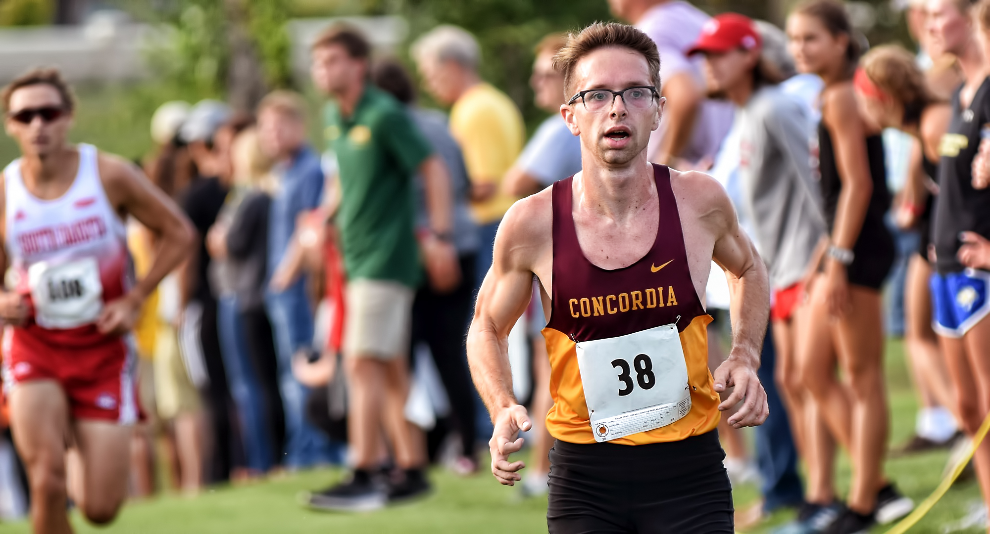 Senior Eric Wicklund crosses the finish line at the NDSU Bison Open. He earned MIAC Athlete of the Week honors for his stellar season-opening outing.