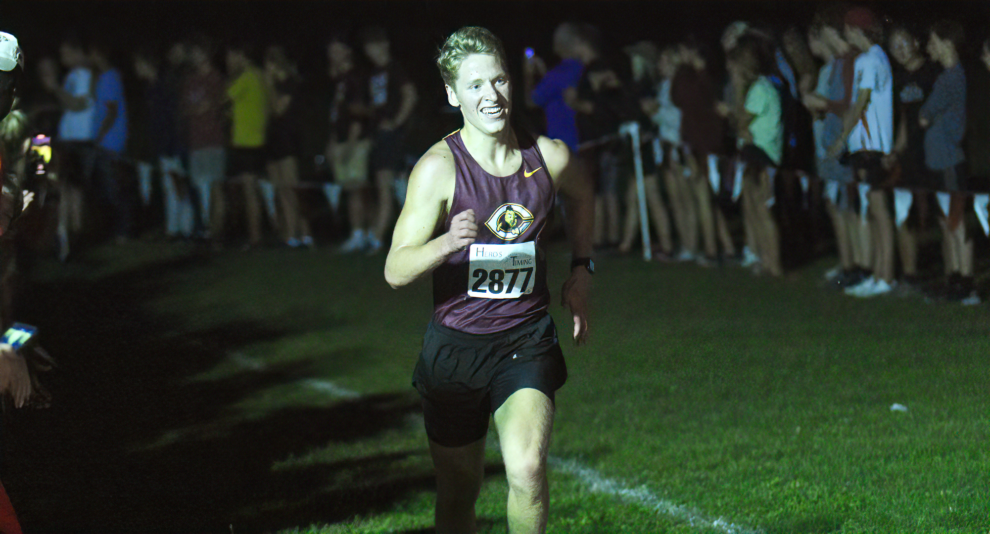 Freshman Joe Lee heads down the chute to the finish line at the MSU Moorhead Twilight Meet. He was the team's No.2 runner and placed 11th at the meet.