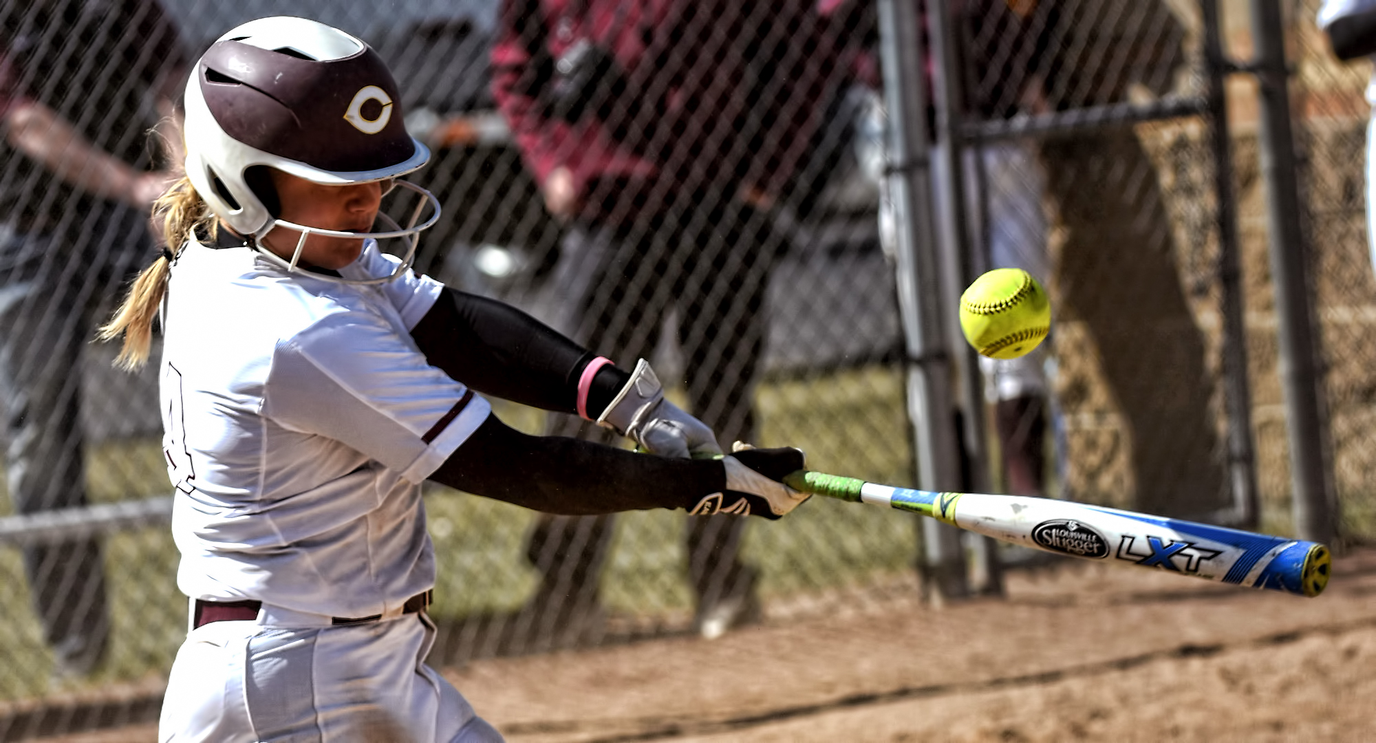 Sophomore Brooke Ankerfelt connects on a pitch during the second game of the Cobbers' wind swept DH with Augsburg.