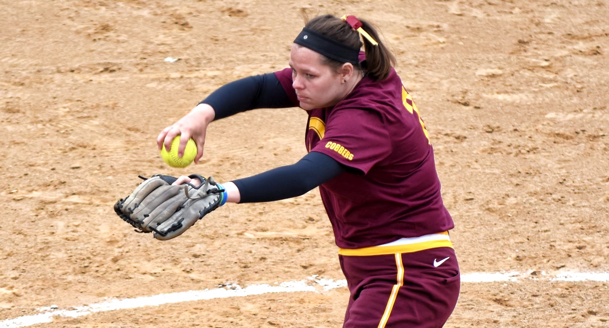 Senior Abby Haraldson gets ready to deliver a pitch during the final game of her college career. She pitched a complete-game shutout to help the Cobbers sweep UM-Morris 8-7, 8-0.