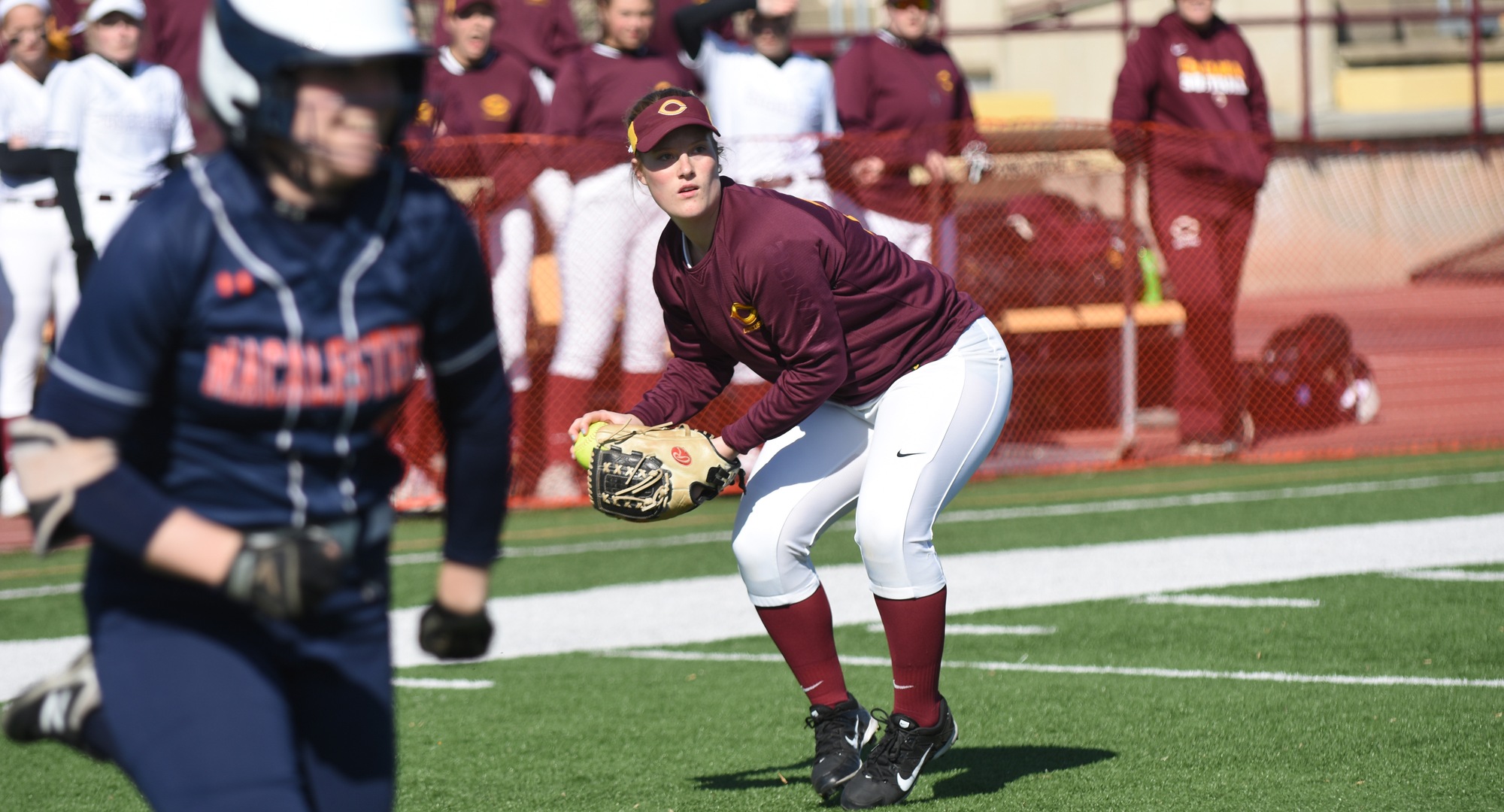 Cobber third baseman Taylor Erholtz gets ready to make the throw to first base to record an out in the Cobbers' home opener with Macalester.