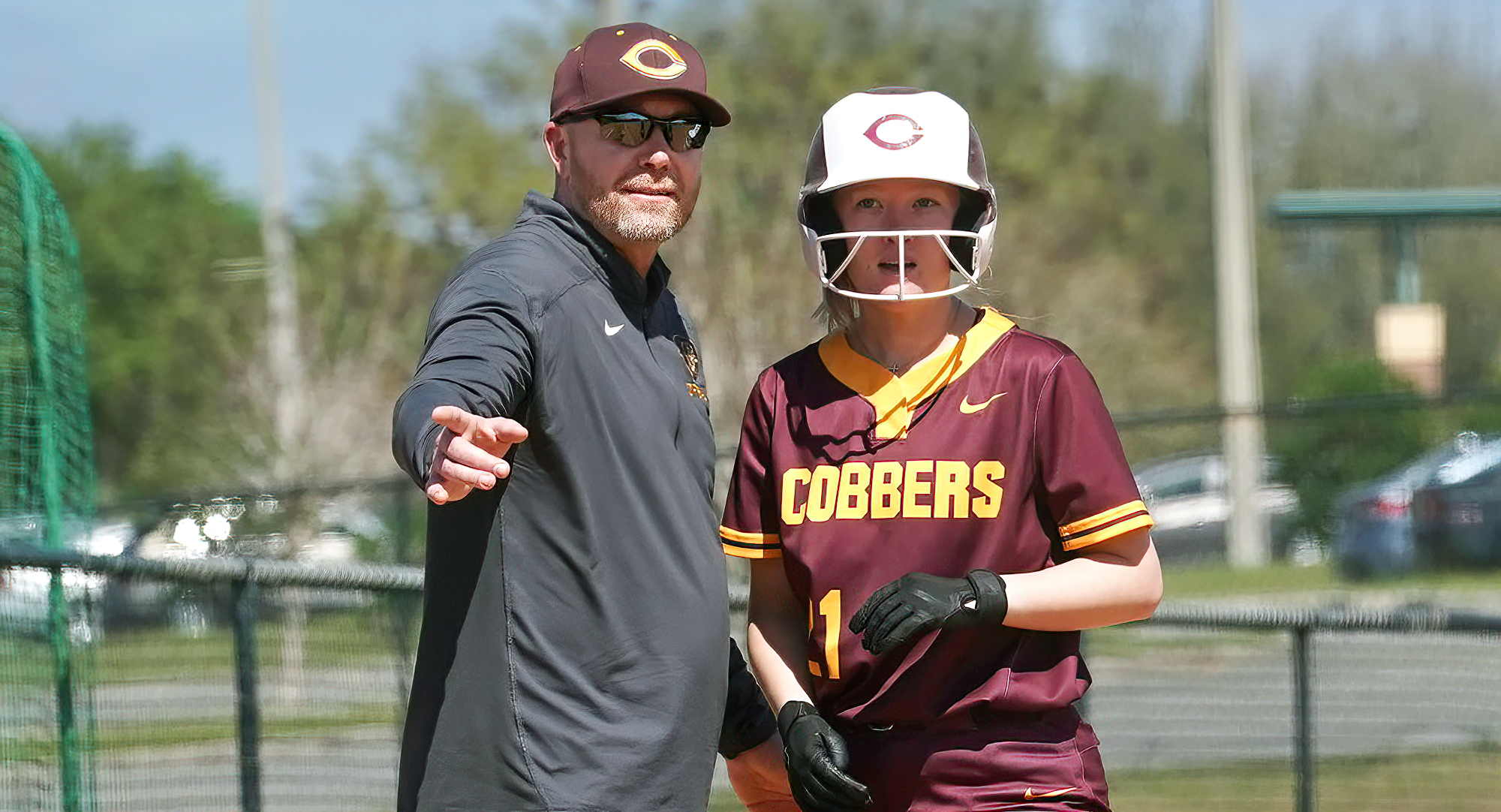 Head Coach Chad Slyter talks to freshman Lexi Burke during the Cobbers' 6-0 win over Regis. (Pic courtesy of courtesy of Jim/Jill Kolstad)