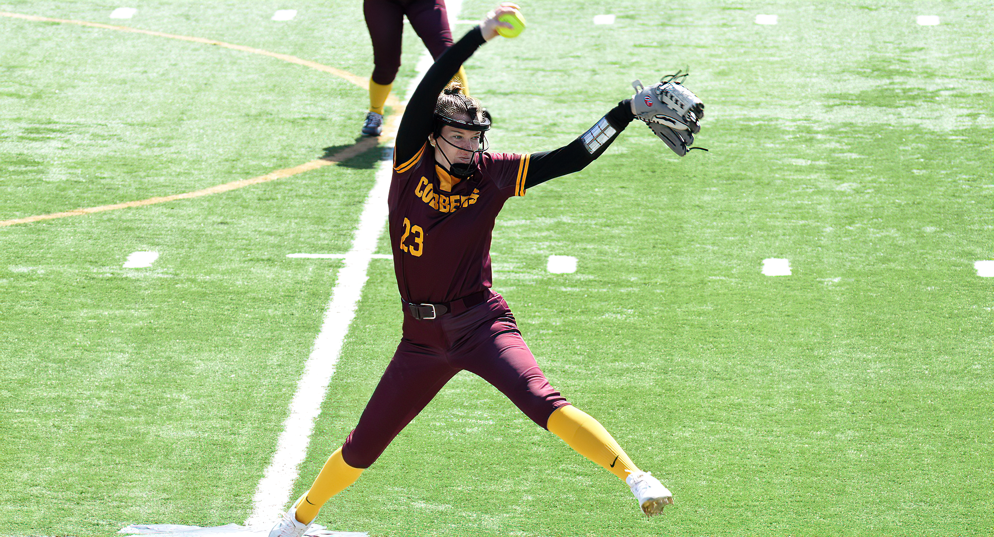 Senior Megan Gavin delivers a pitch during the Cobbers' DH with Bethel. Gavin pitched all 14 innings, struck out 21 and only allowed one earned run.
