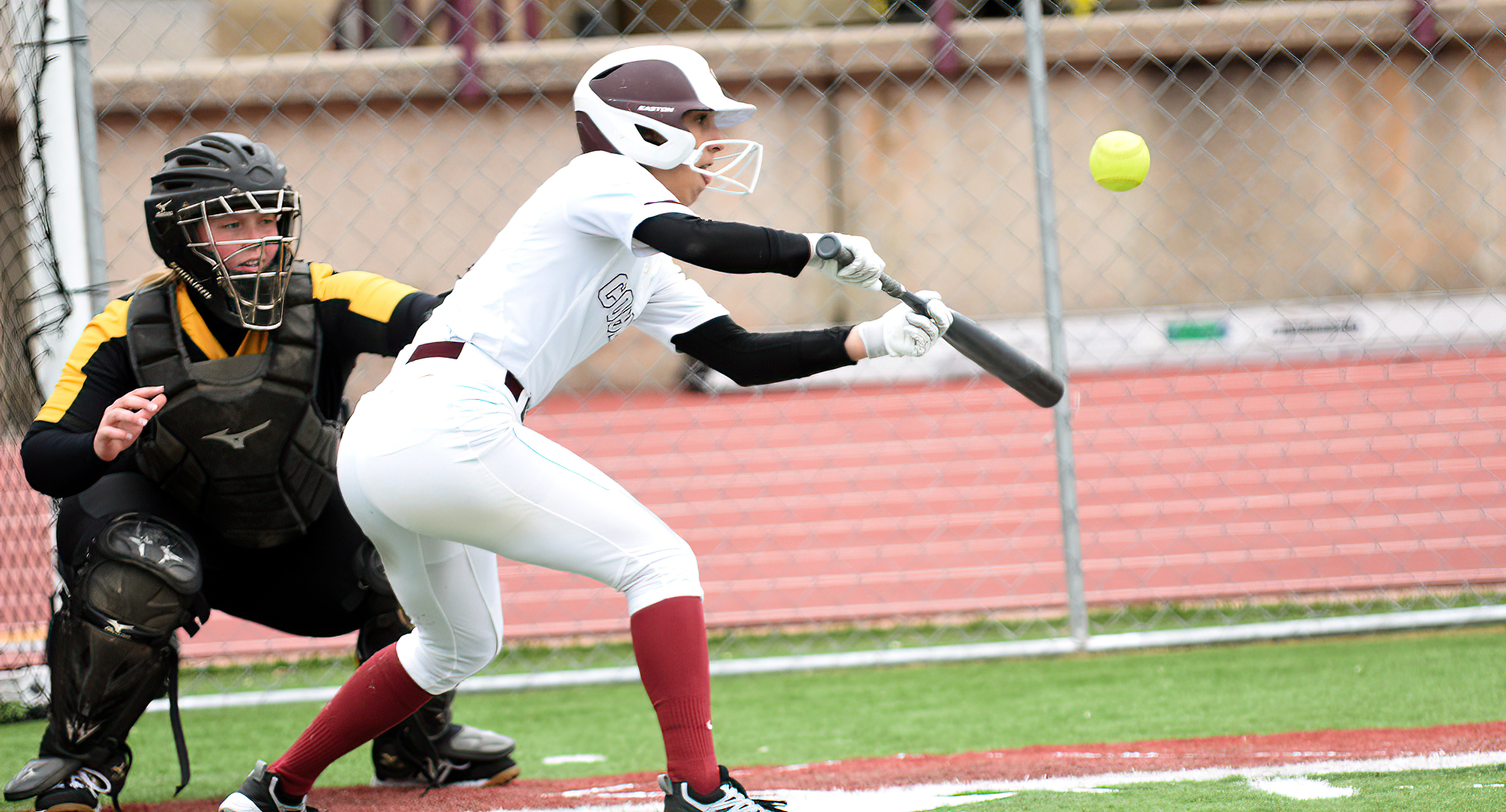 Freshman Rosie Unglaub lays down a bunt in the Cobbers' first game vs. Gustavus. She had a season-high three hits and stole three bases.