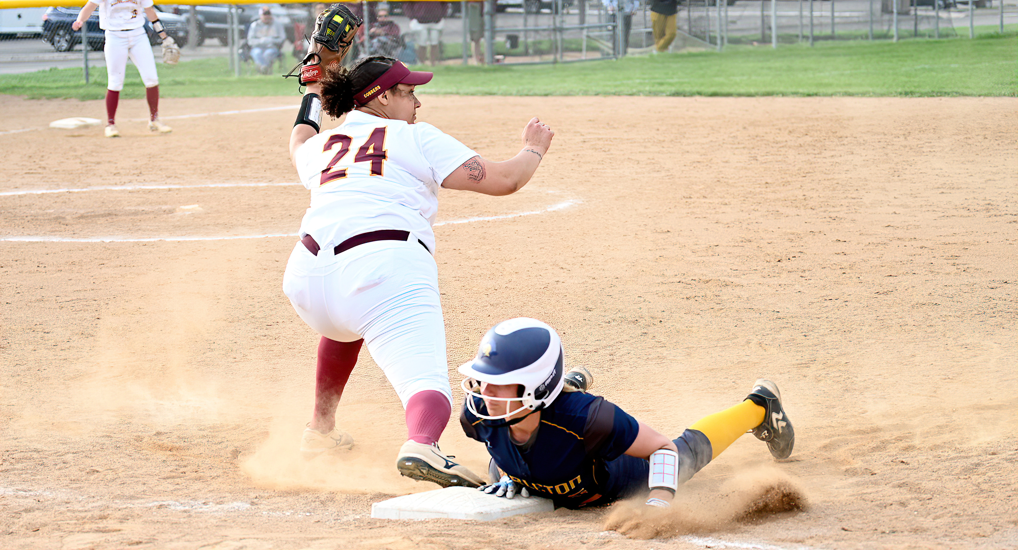 Gabby Brown stretches to catch the ball at first base on an attempted double play in the second game of the Cobbers' doubleheader with Carleton.