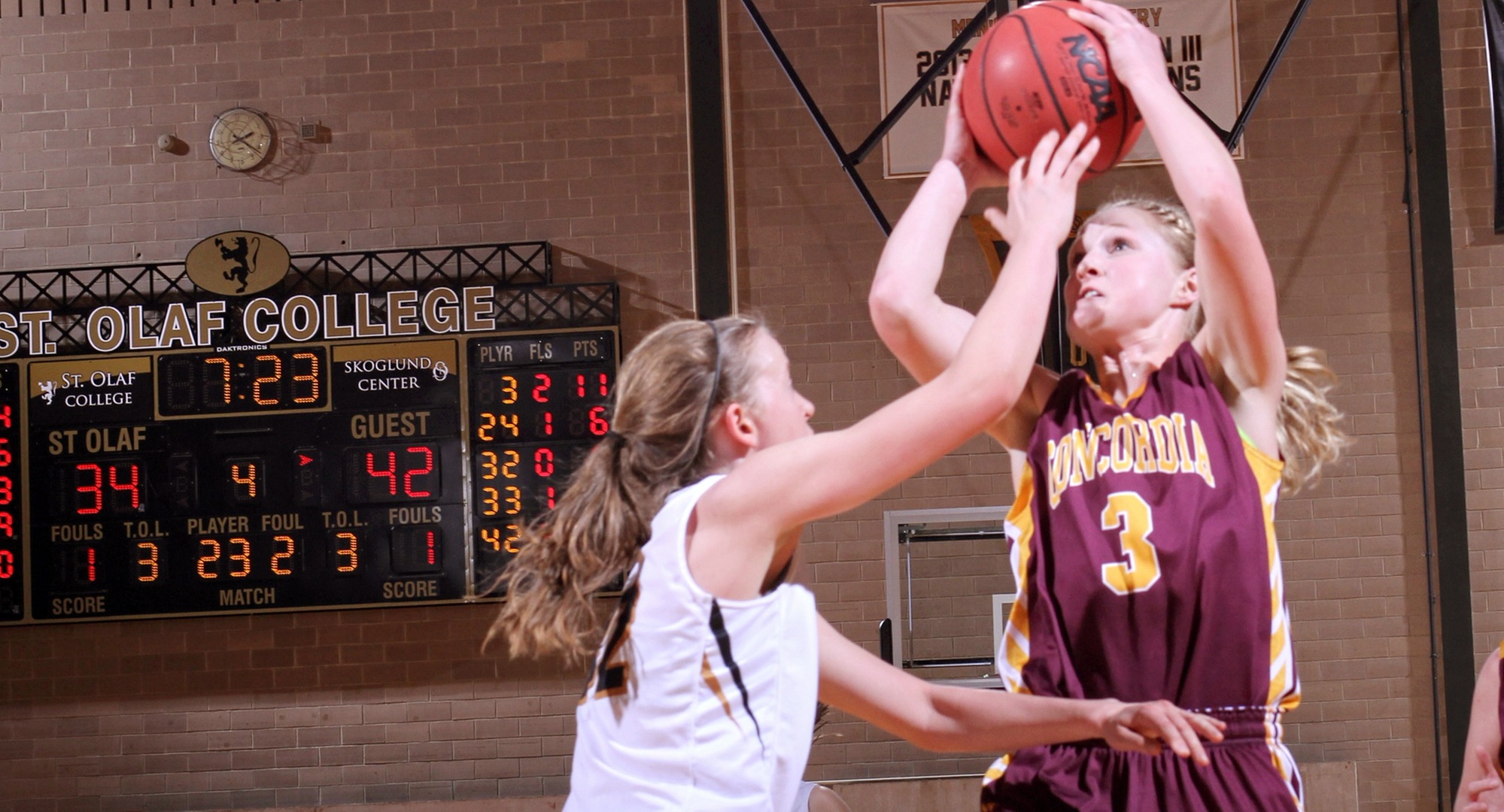 Senior Greta Walsh drives to the basket in the fourth quarter for two of her game-high 21 points in the Cobbers' win at St. Olaf. (Photo courtesy of St. Olaf Sports Information Department)