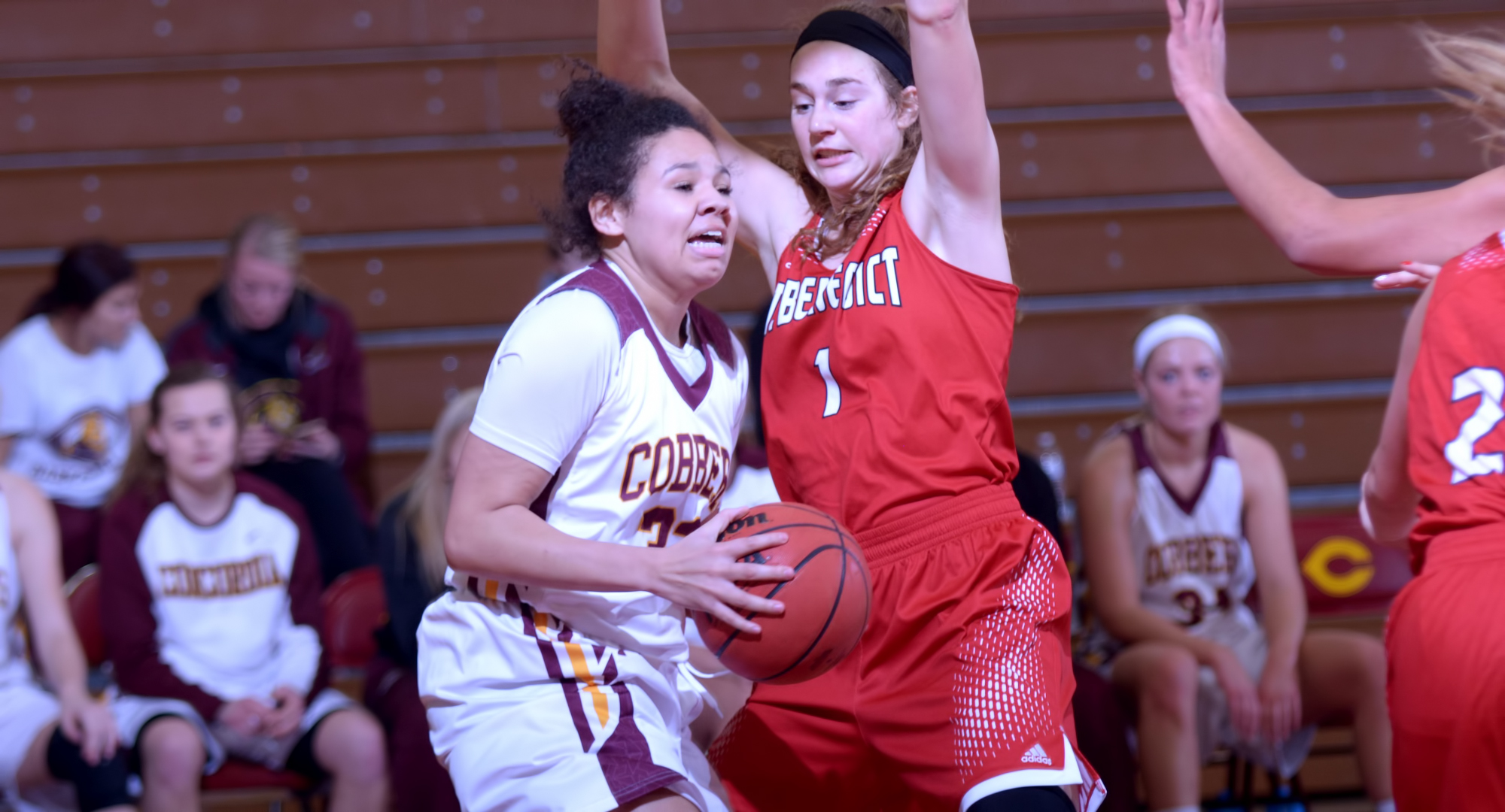 Sophomore Aleya Parker tries to get past a St. Benedict defender during the Cobbers' first game of 2018. Parker finished with seven points.