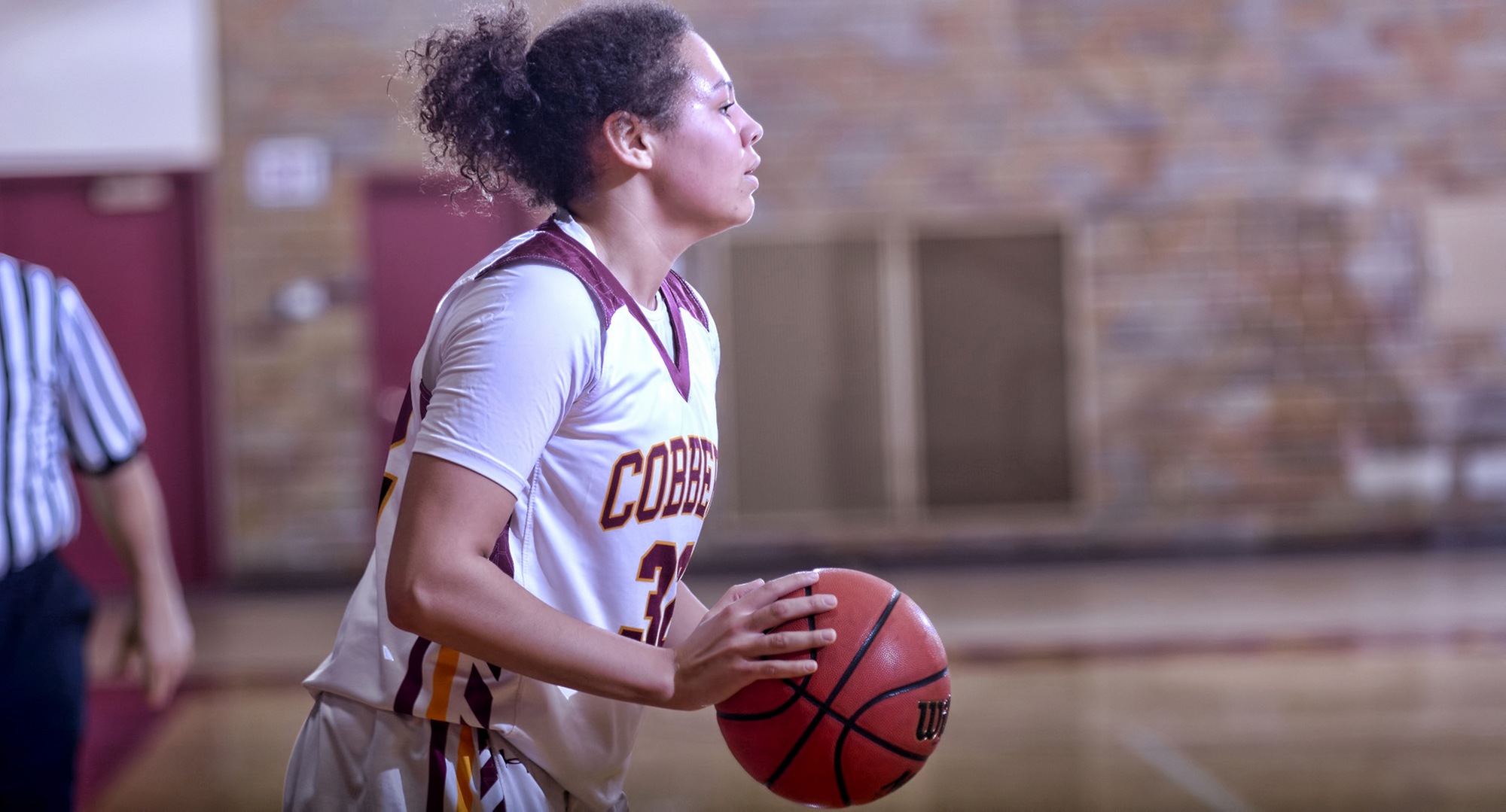 Sophomore Aleya Parker looks to make an entry pass during the second half of the Cobbers' win against Macalester. She finished with a career-high 16 points.