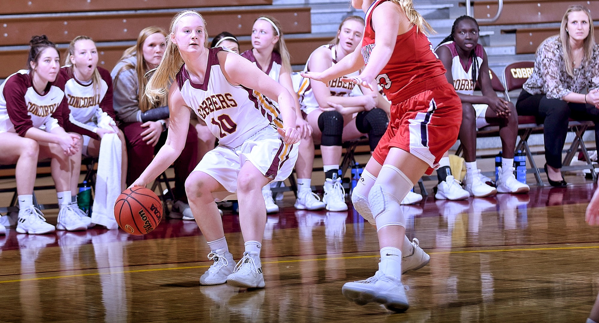 Sophomore Elizabeth Birkemeyer  dribbles the ball towards the basket in the second half of the Cobbers' game with St. Mary's. She finished with career-high totals in points, rebounds and assists.