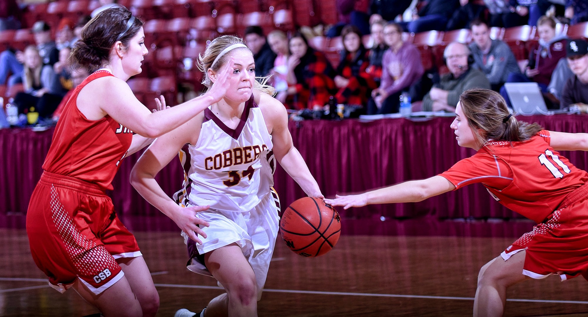 Senior Grace Wolhowe dribble through the defense in the second half of the Cobbers' game with St. Benedict. Wolhowe scored a career-high 27 points in the game.