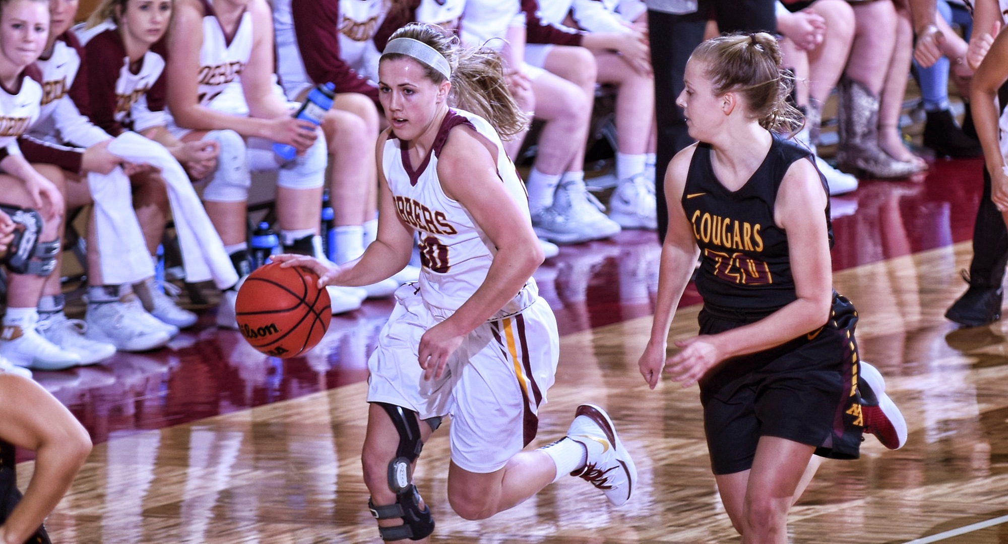 Freshman Emily Beseman brings the ball up the court against a Minn.-Morris defender during the Cobbers' 78-63 win. Beseman finished with 23 points in her college debut.