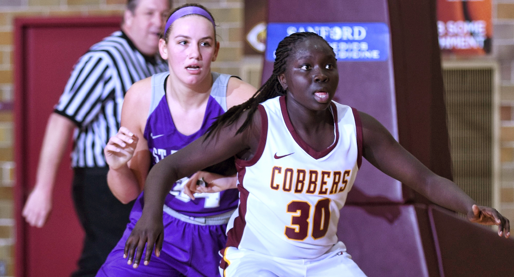 Sophomore Mary Sem posts up a St. Thomas player during the second half of the Cobbers' first game of 2020. Sem tied her career-high with 25 points.