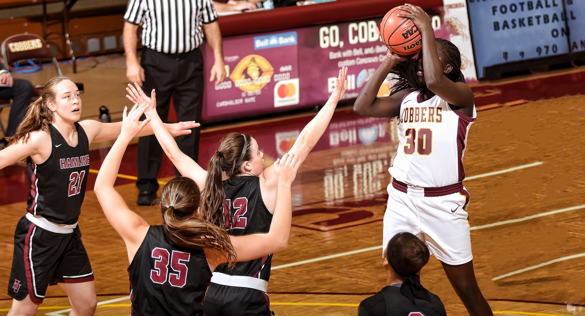 Sophomore Mary Sem goes up for two of her career-high 34 points among four Hamline defenders in the Cobbers' game with the Pipers.