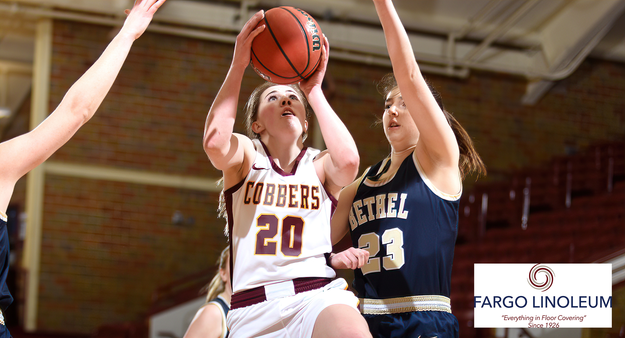 Emily Beseman drives the ball to the basket and goes up for two of her game-high 24 points in the first half of the Cobbers' win over Bethel.