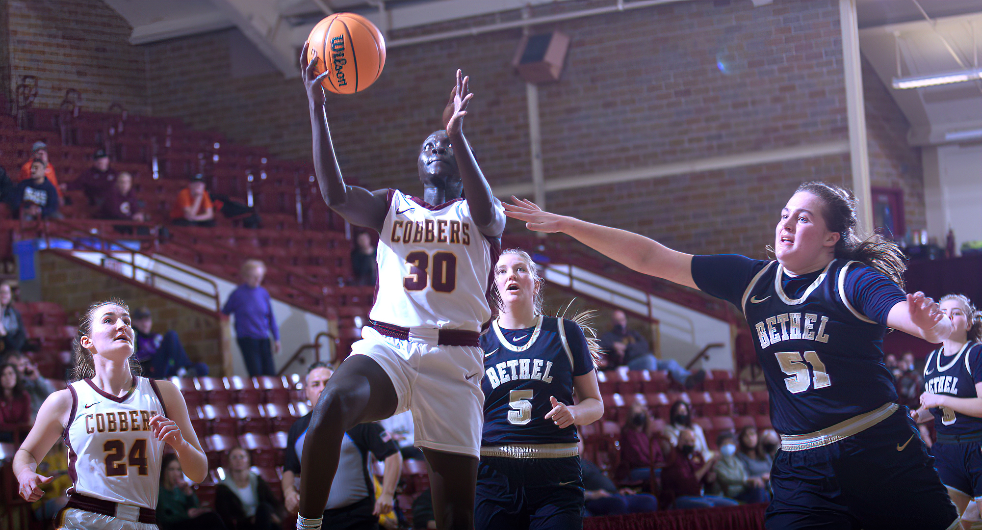 Senior Mary Sem drives past the Bethel defense on her way to a pair of her team-high 15 points in the Cobbers' home game with the Royals.