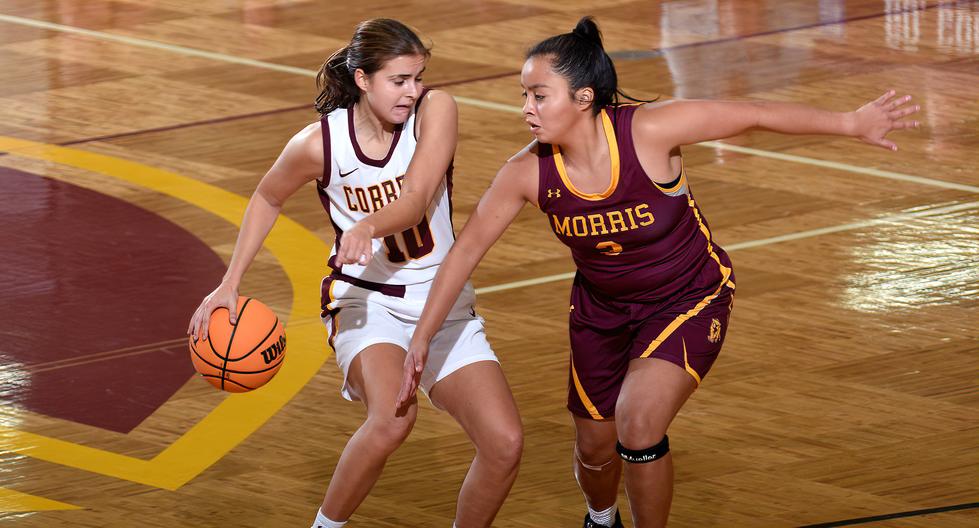 Sophomore Carlee Sieben shields the ball from a Morris defender in the Cobbers' 85-60 win. Sieben finished with a game-high 27 points.
