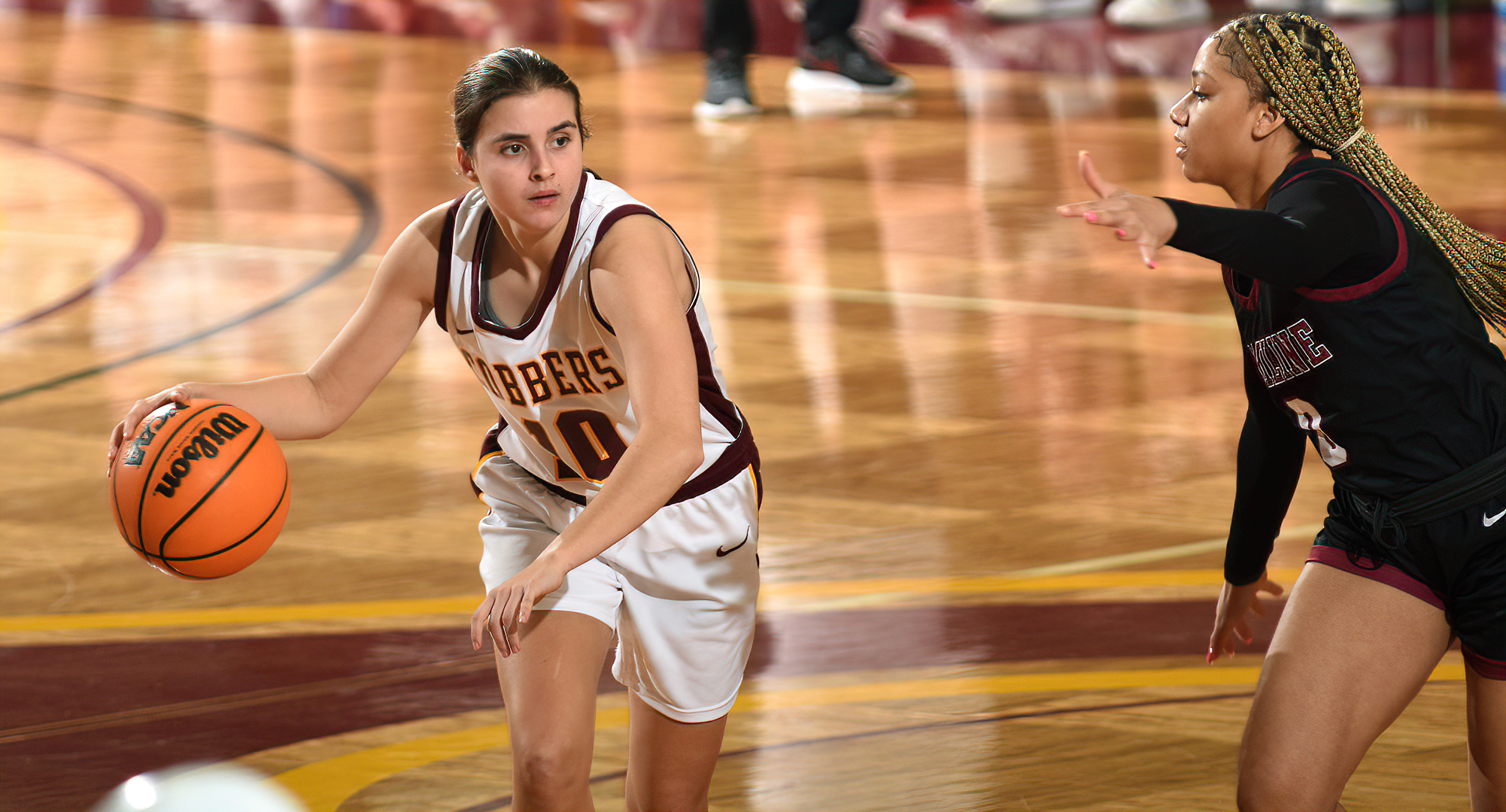 Sophomore Carlee Sieben brings the ball up the court during the second half of the Cobbers' semifinal win over Hamline.