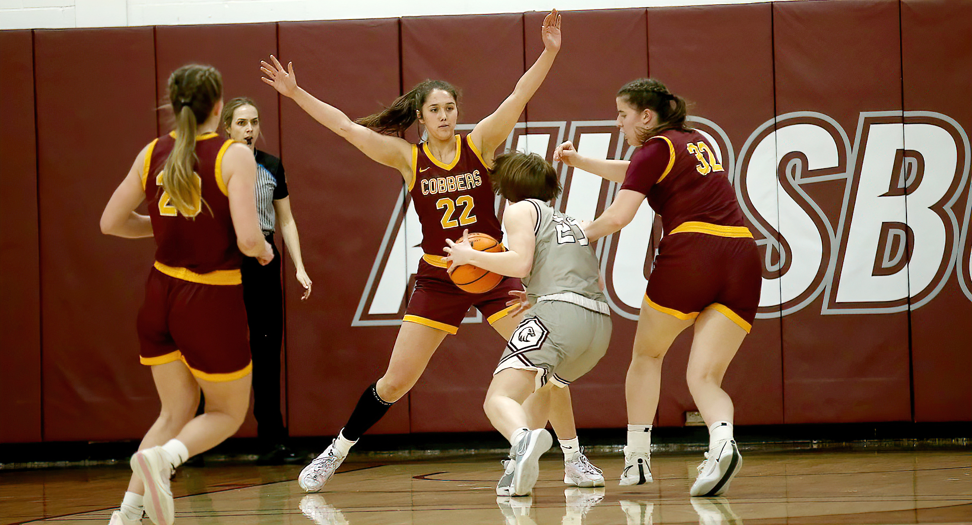 Makayla Anderson (#22) closes off the lane in the Cobbers' win at Augsburg. She had 19 points. (Photo courtesy of Ryan Coleman, D3photography)